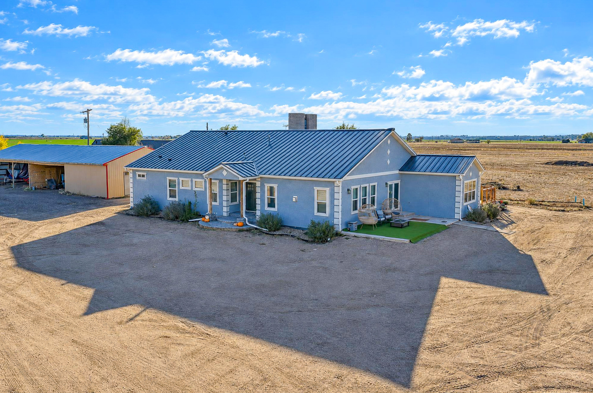 Home + Acreage Aerial — custom 2023 ranch home on 4 acres in Platteville, Colorado