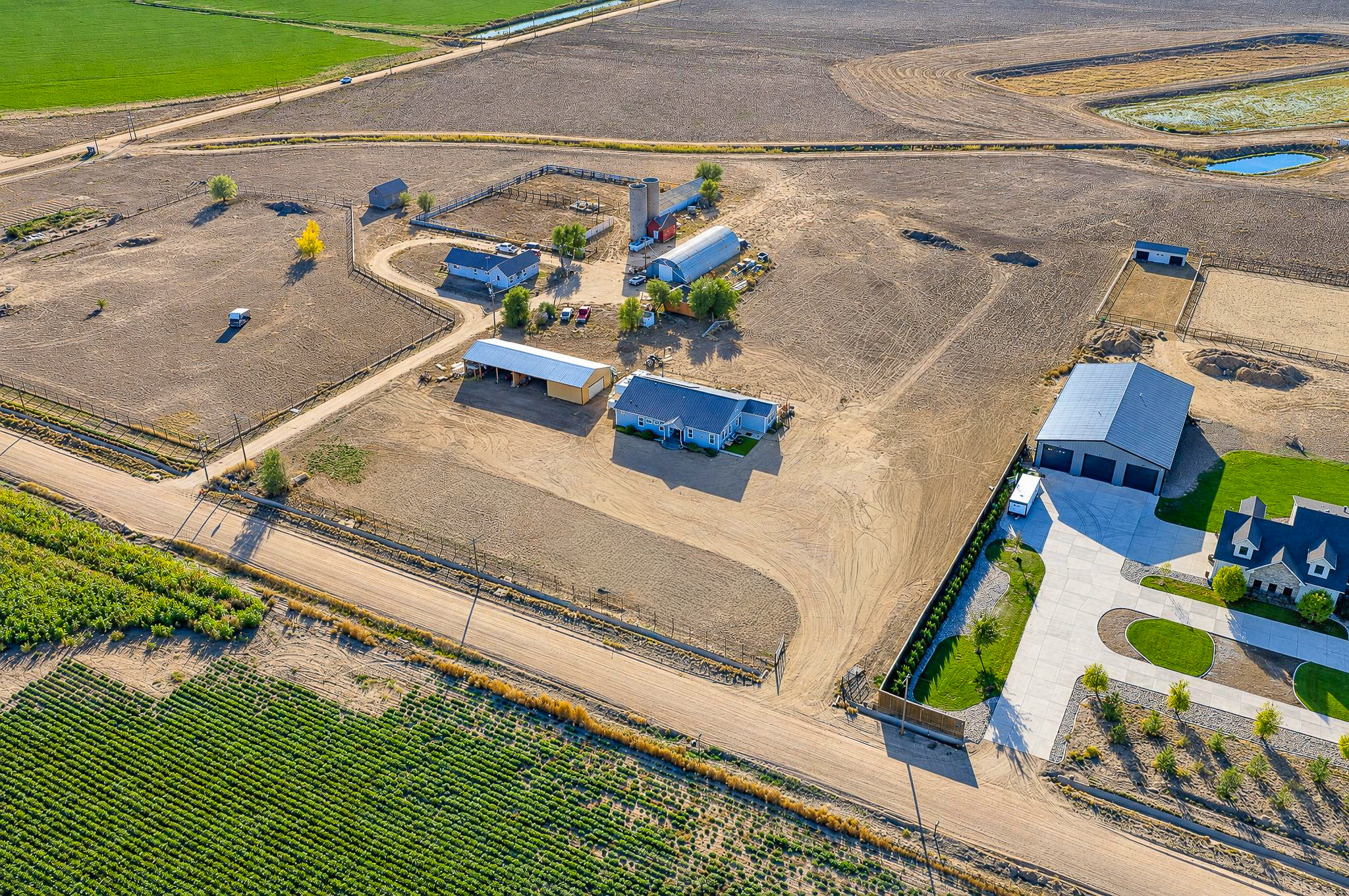 Acreage + Farmland Aerial — custom 2023 ranch home on 4 acres in Platteville, Colorado
