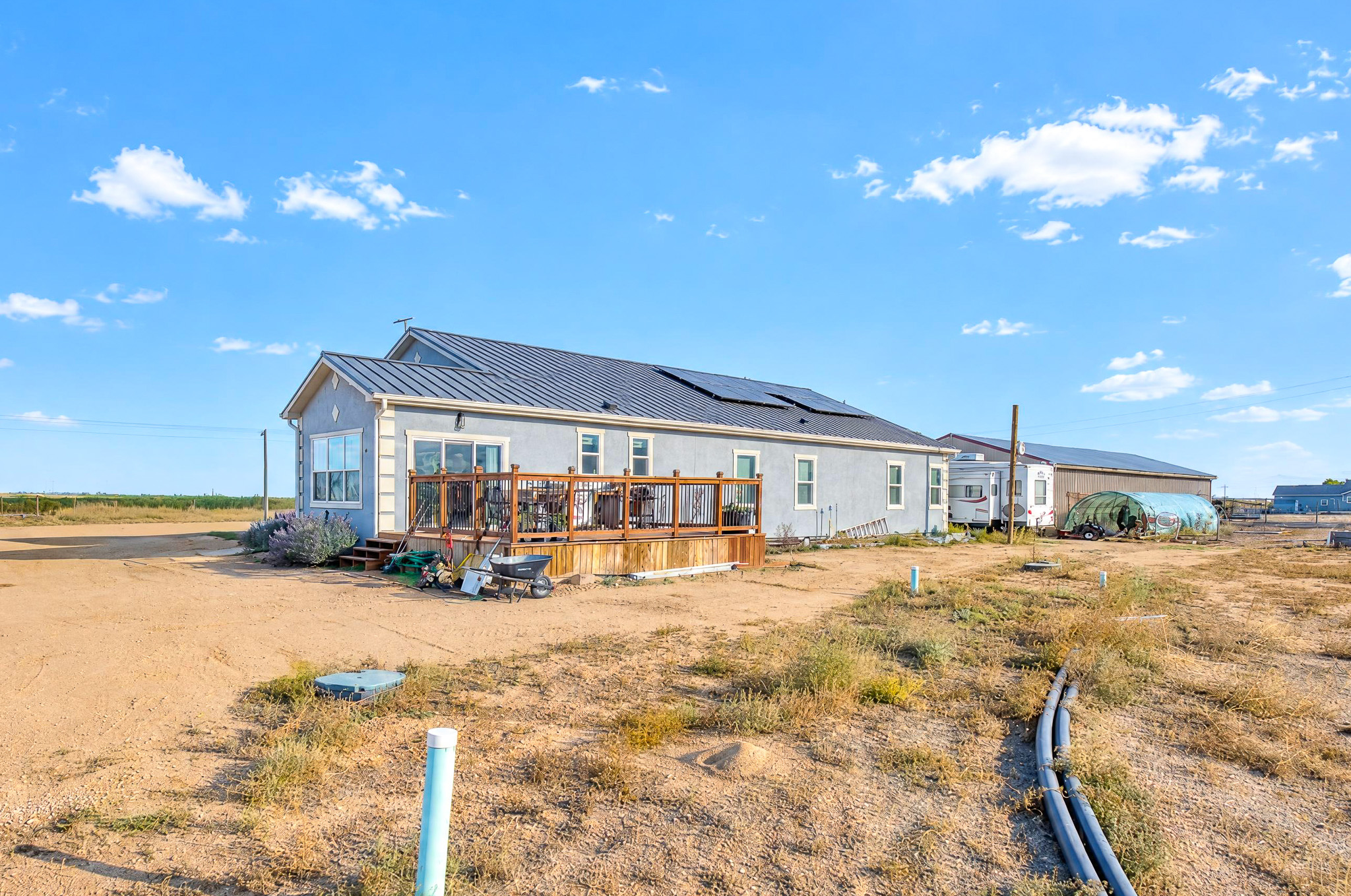 Rear Exterior + Deck — custom 2023 ranch home on 4 acres in Platteville, Colorado