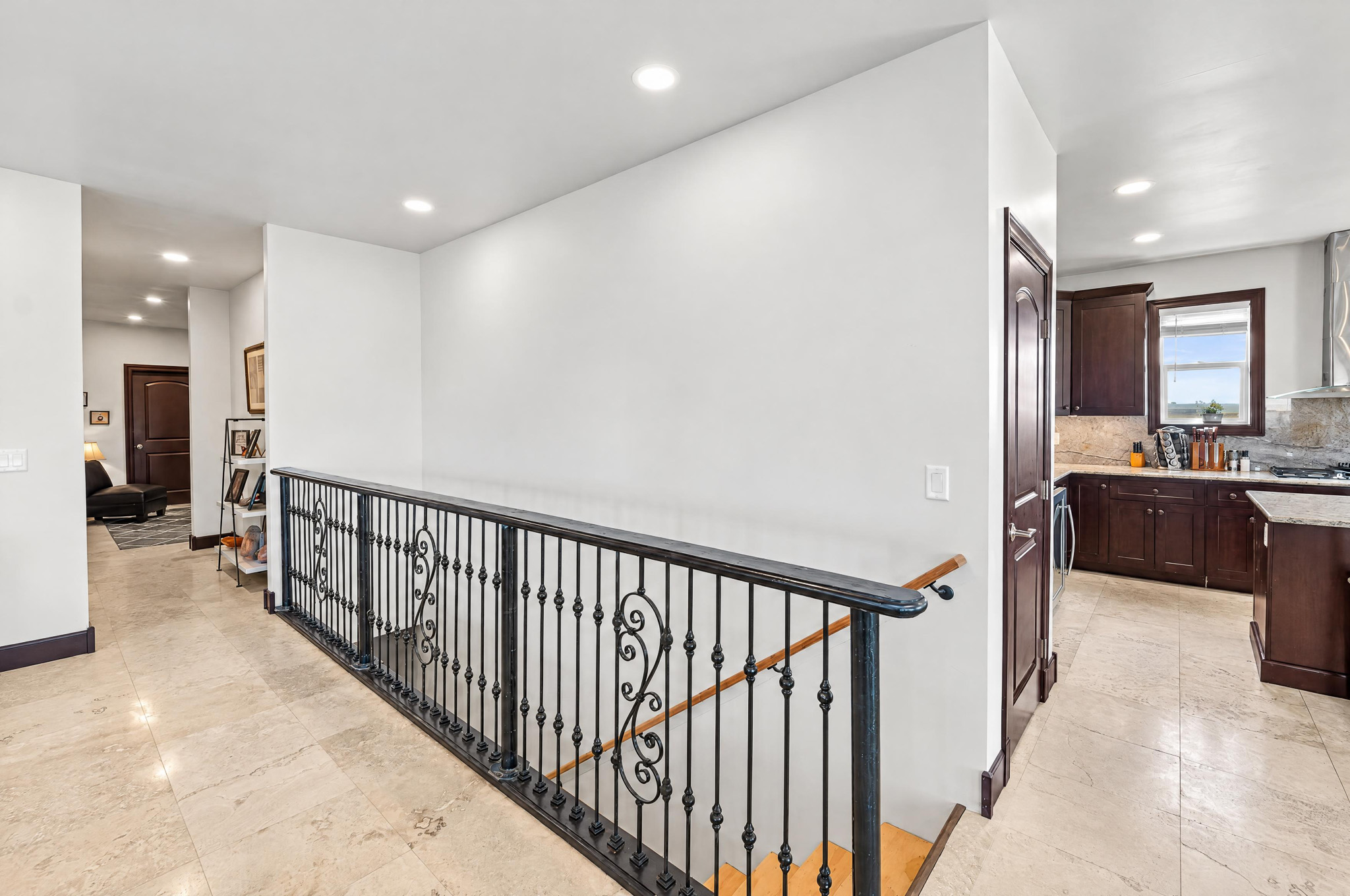 Open Railing + Loft Hall — custom 2023 ranch home on 4 acres in Platteville, Colorado