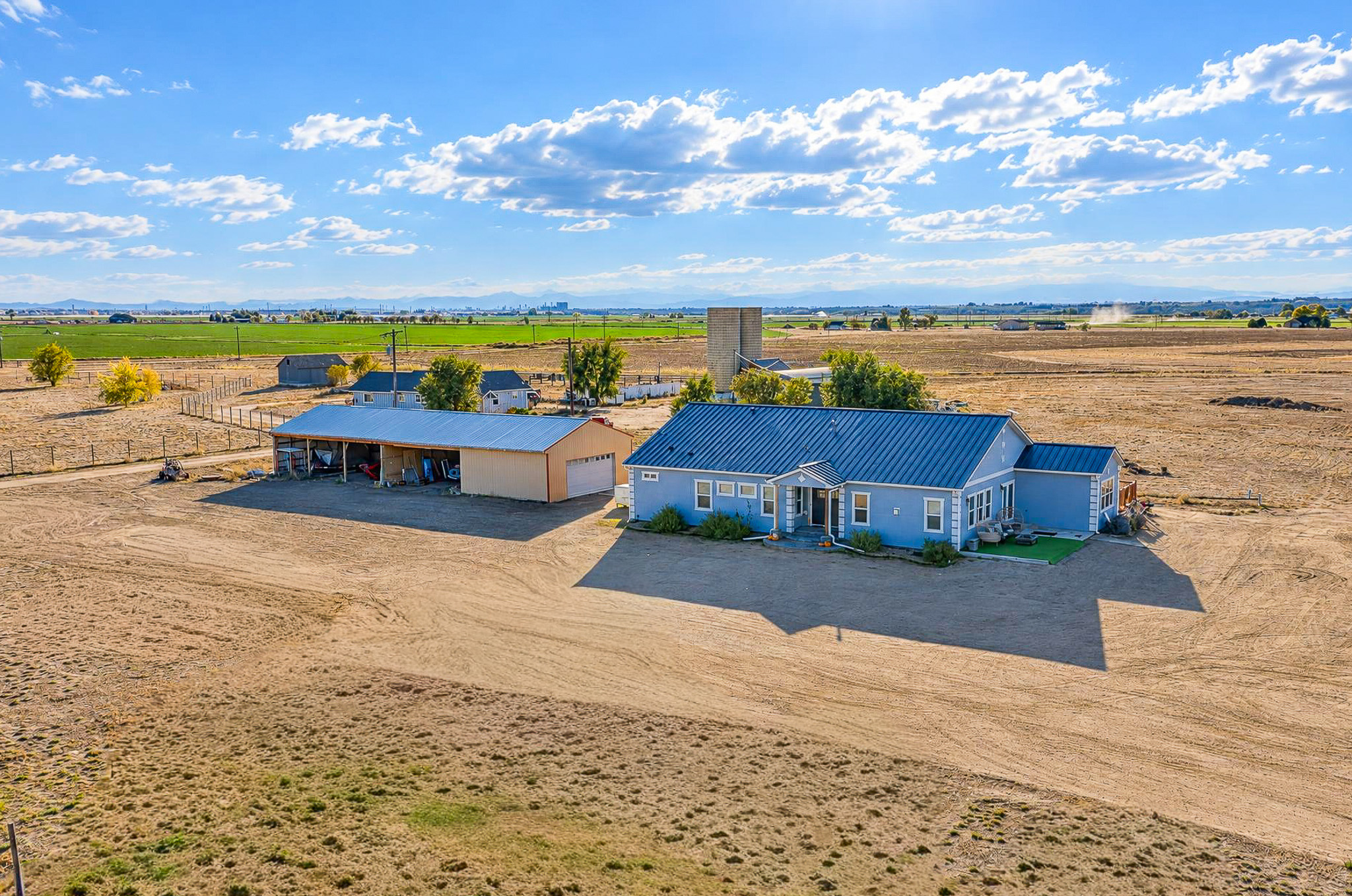 Home + Shop Aerial — custom 2023 ranch home on 4 acres in Platteville, Colorado